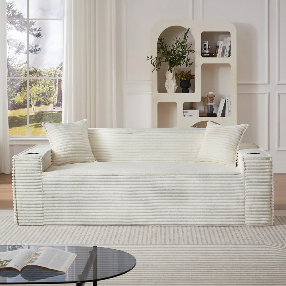 White corduroy boneless 3-seater couch with two ribbed pillows in a bright living room
